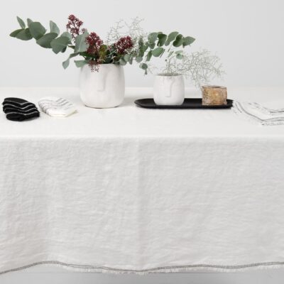 ALBA Tablecloth white 12 white linen tablecloth with decorative seam with loose fringes.