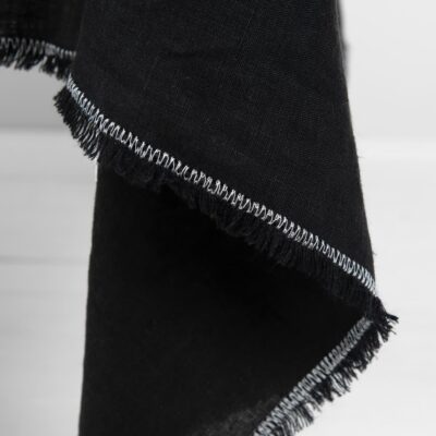 ALBA Tablecloth black 10 linen black tablecloth with decorative seam in white.