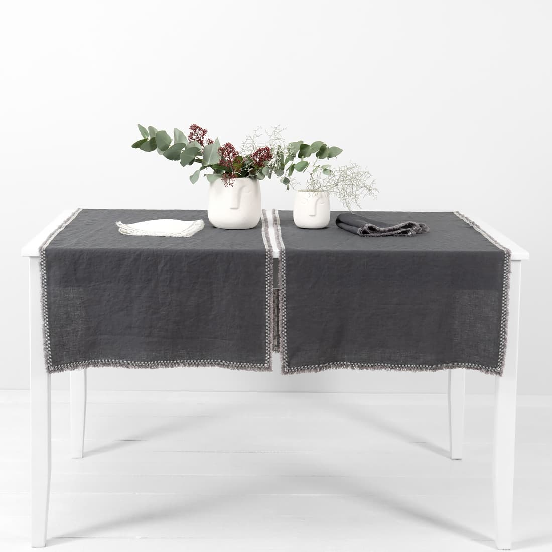 grey linen runner with decorative stitch