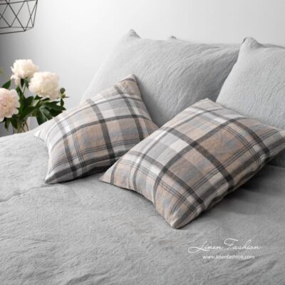 Grey colored linen cushion cover.