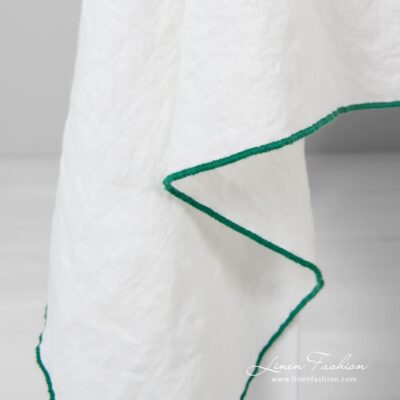 Off-white linen tablecloth with bright green babylock stitch