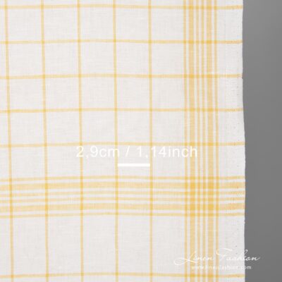 White linen cotton fabric with yellow checks 4 White fabric with green checks narrow width close up view