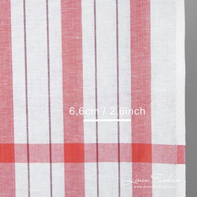 Narrow white linen cotton fabric with red stripes detail close up view