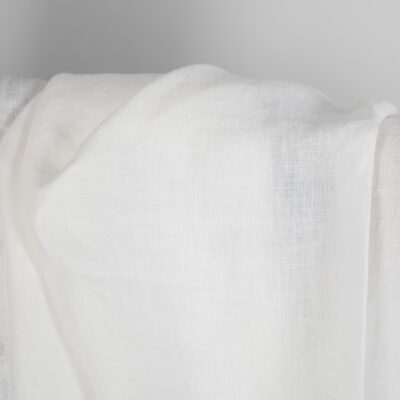 Washed linen fabric in off-white close up detail