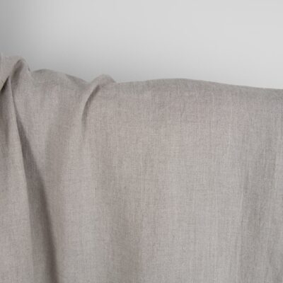 Washed linen fabric in natural grey close up detail