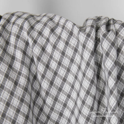 Light grey linen fabric with dark grey checks, washed