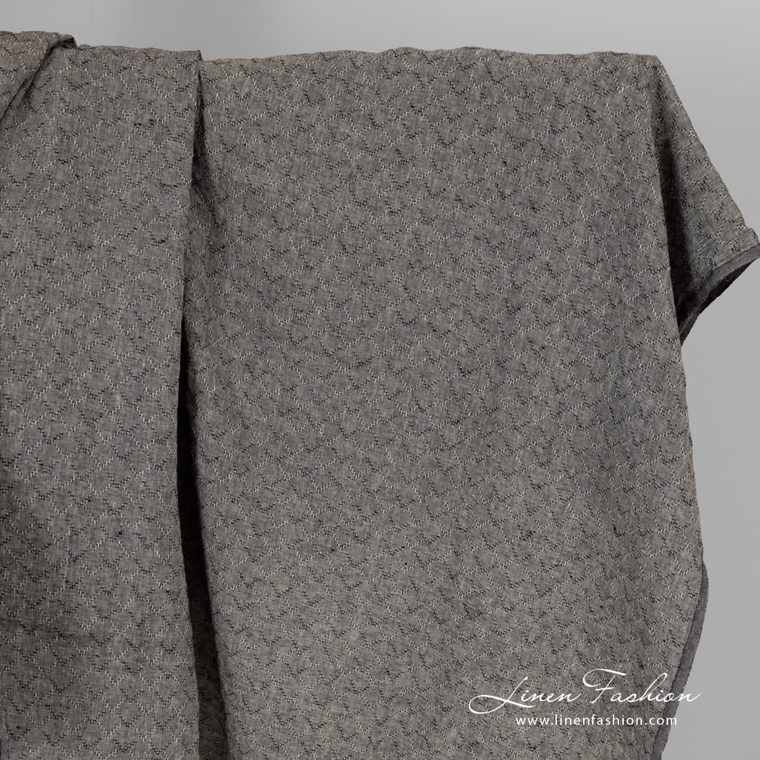 Black melange linen fabric with diamonds, washed.