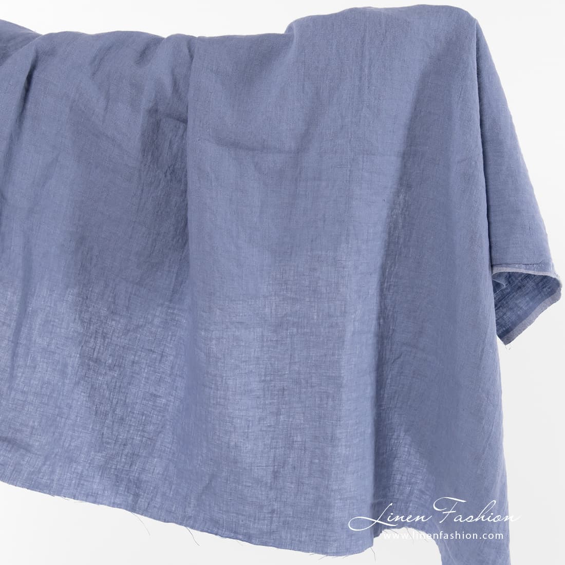 Dusty blue linen fabric, washed.