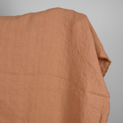Linen washed fabric light brown color for sewing clothes and home textiles close view