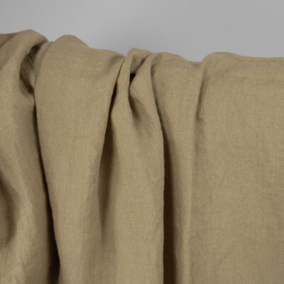 Washed linen fabric in greenish-beige, texture