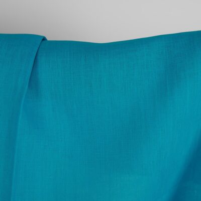 Linen fabric in vivid blue colour close up detail