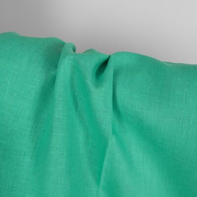 Pure linen fabric in green close up detail