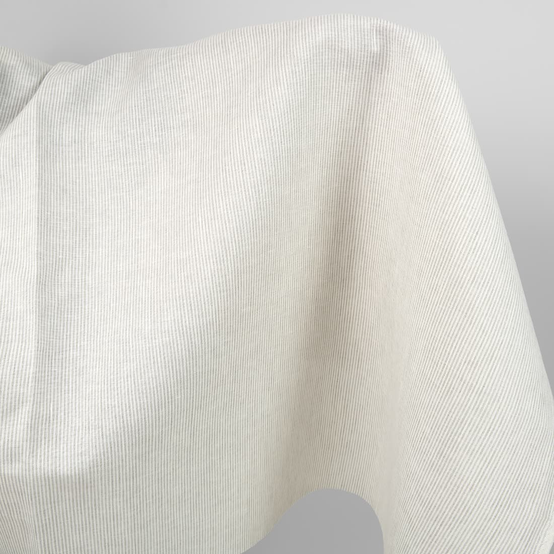 Linen fabric in natural and white colour stripes product close up view