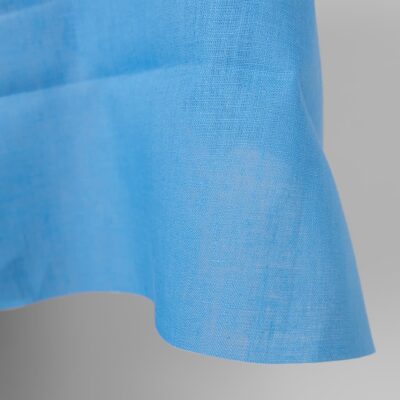 Linen fabric sky blue colour close up edge