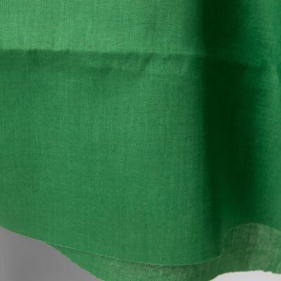 Linen fabric emerald green colour detail edge view