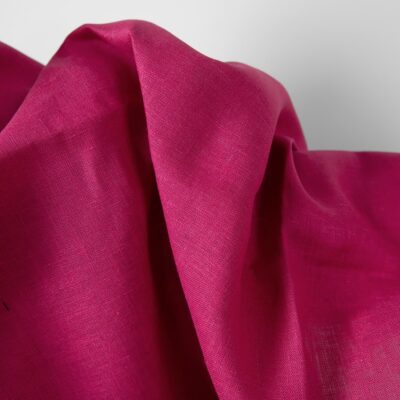 Linen fabric magenta colour close up product photo