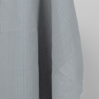 blue grey fabric with open stripes vertically.