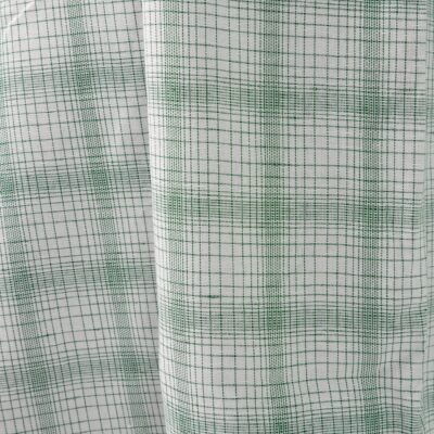 White linen cotton fabric with striped green checks close view photo