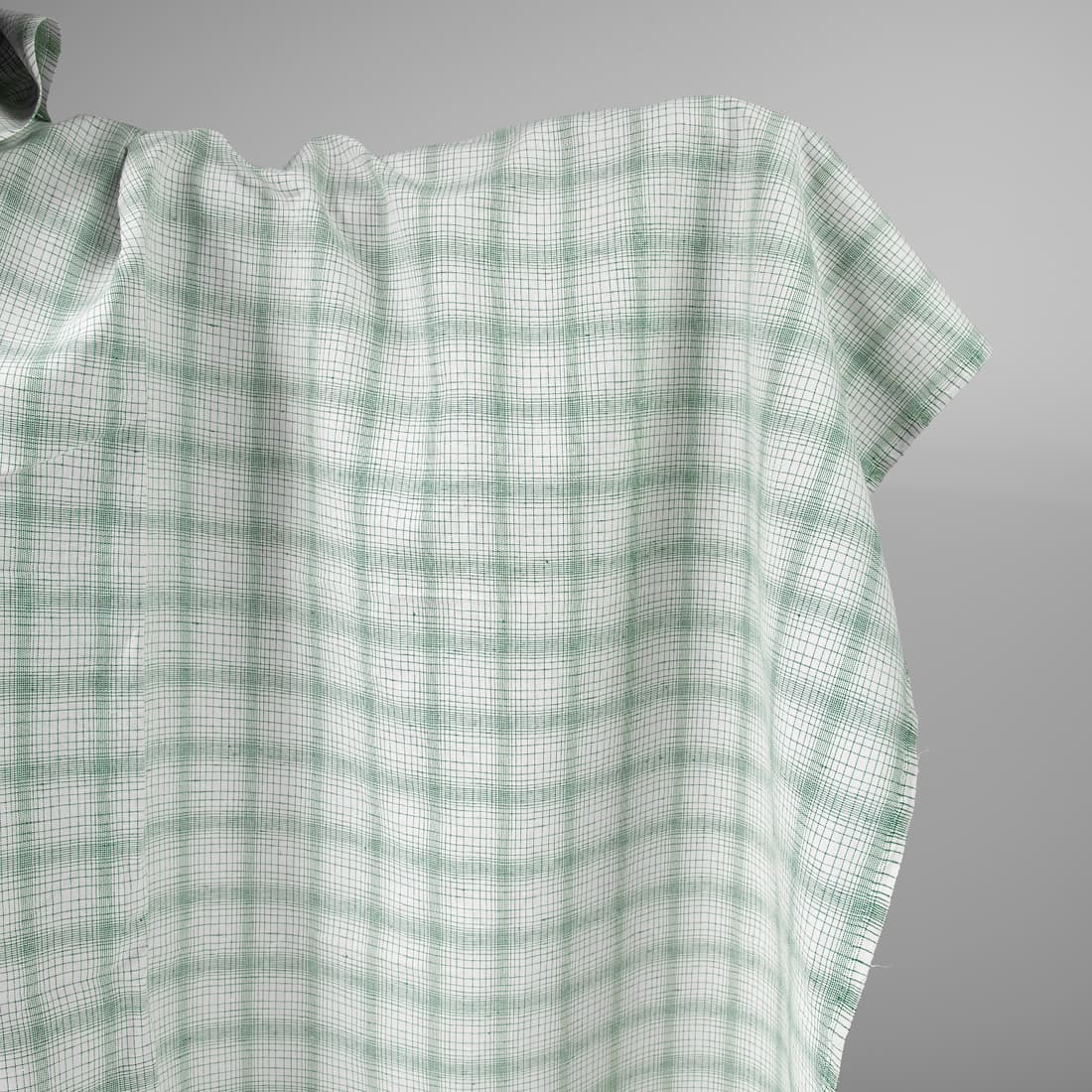 White linen cotton fabric with striped green checks