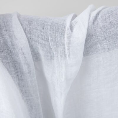 Bright white transparent linen fabric washed close up detail