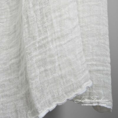 Off-white linen fabric with openwork diamonds washed