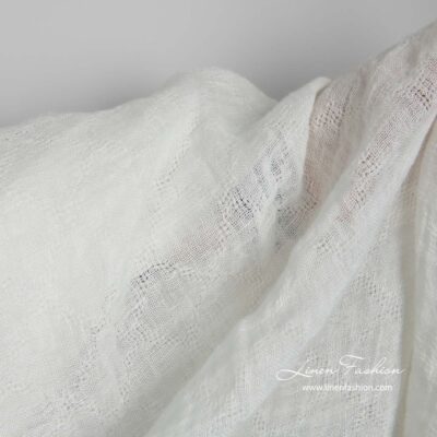 Off-white linen fabric with openwork diamonds washed