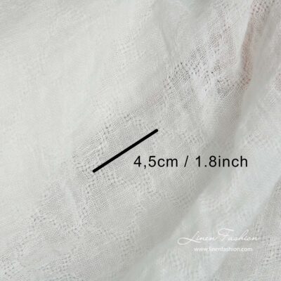 Off-white linen fabric with openwork diamonds washed