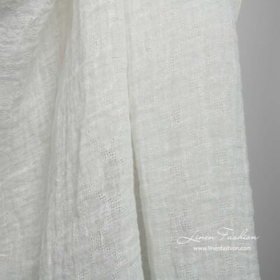 Off-white linen fabric with openwork diamonds washed