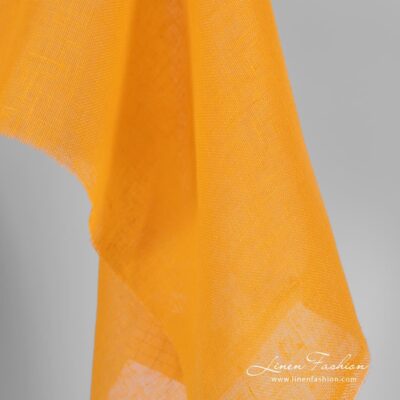 Linen fabric in yellow and orange colors, transparent