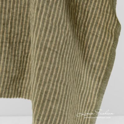 Linen fabric in green and yellowish stripes washed 7 Washed linen fabric in green stripes.