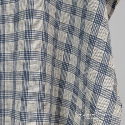 Washed cream colour linen fabric in checks.
