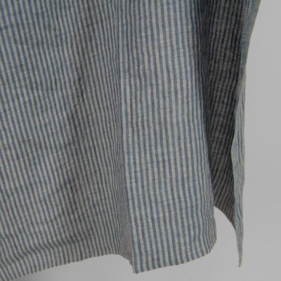 Washed linen fabric with blue stripes edge view