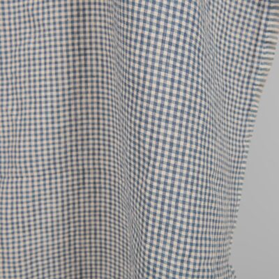 Washed linen fabric with small blue and brownish checks 8 Washed linen fabric with small blue and brownish checks close edge view