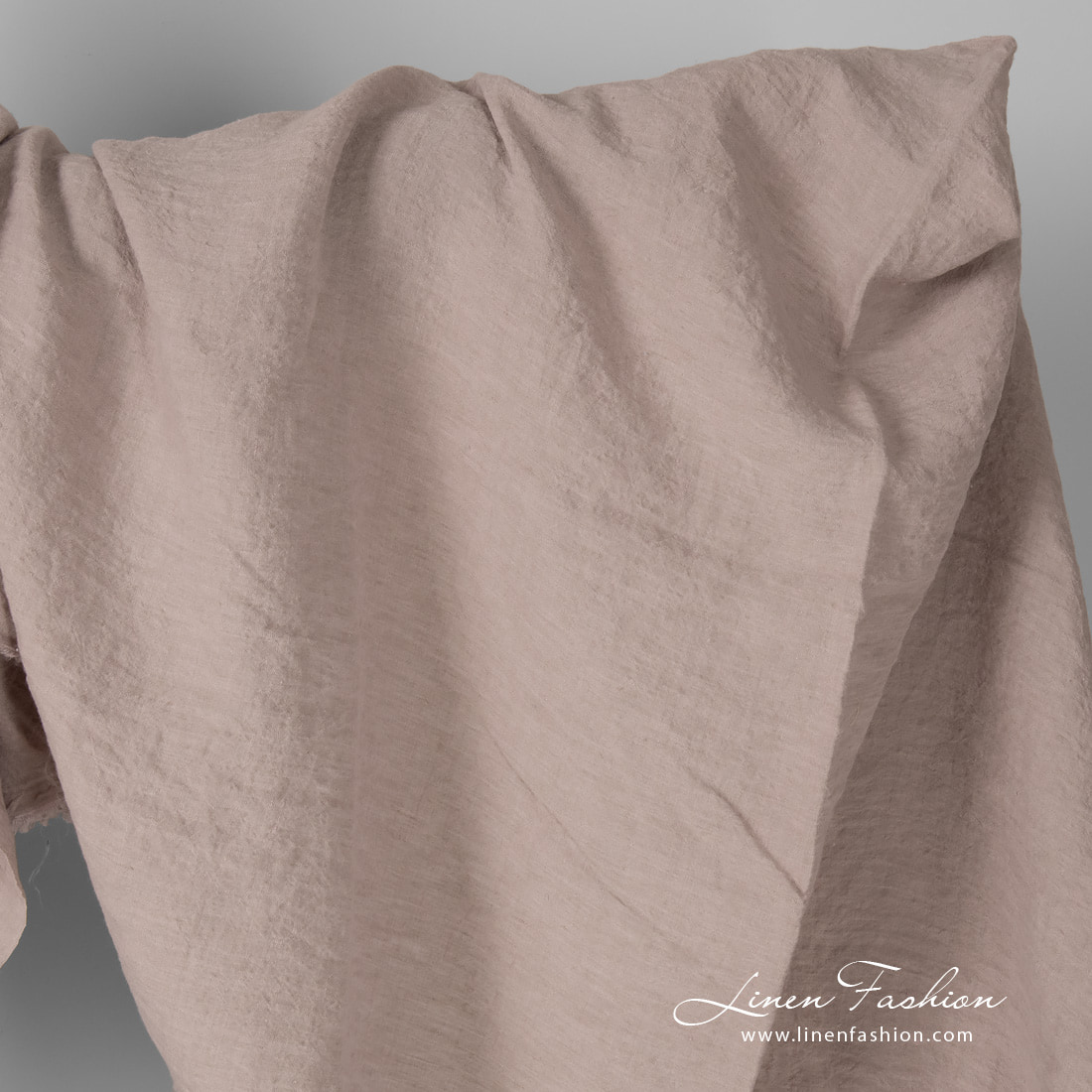 Wide linen fabric in smokey rose colour, washed