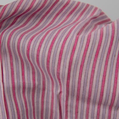 Linen fabric with pink stripes close up detail