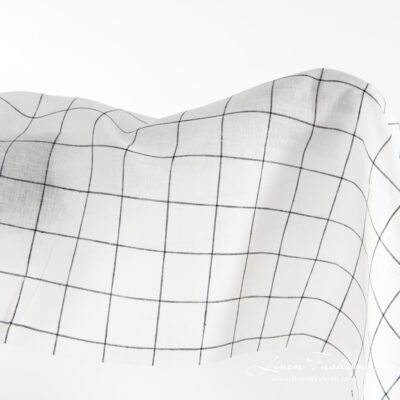 Off-white linen fabric with black grids.