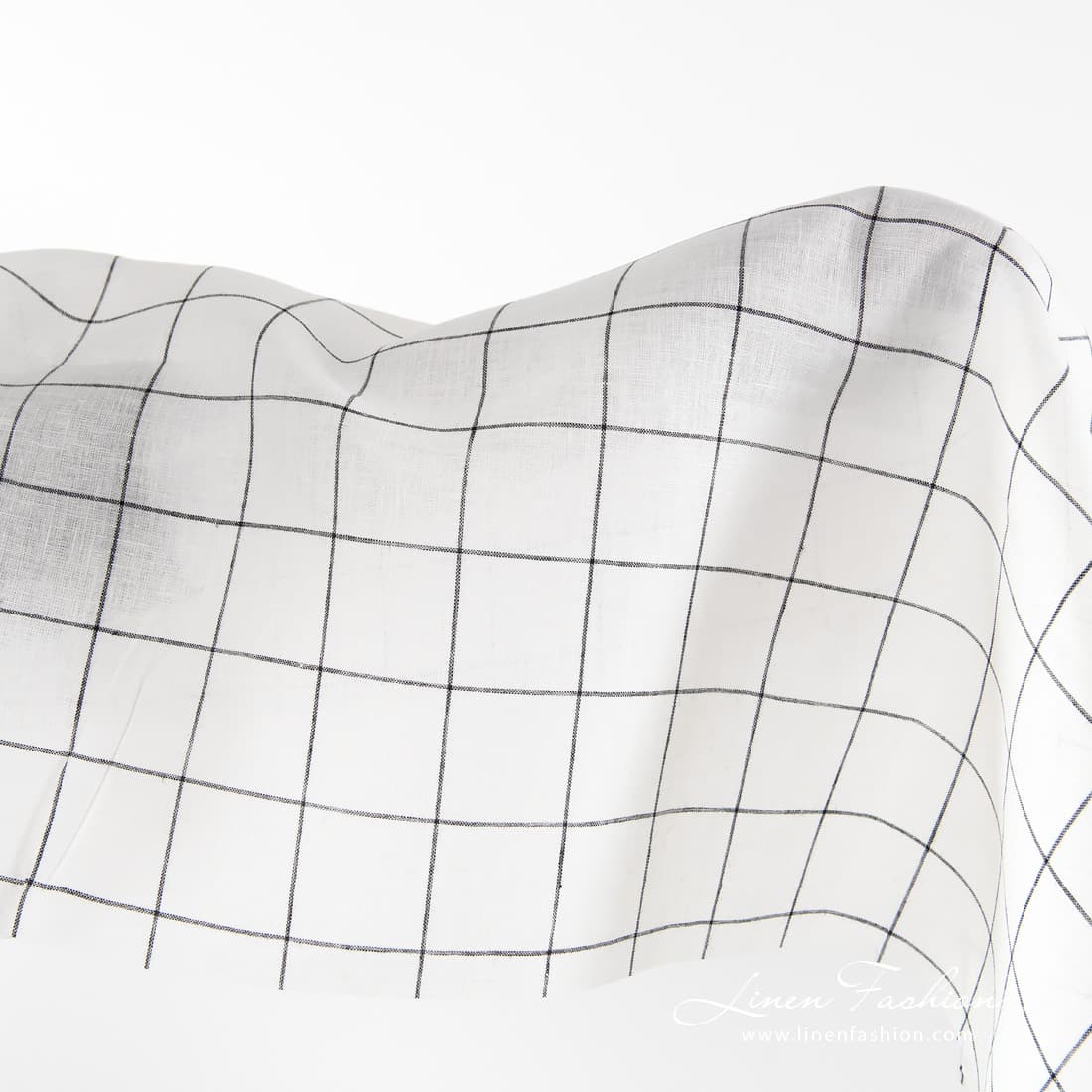 Off-white linen fabric with black grids.