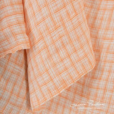 Jacquard linen fabric in orange checks, specially washed to increase softness