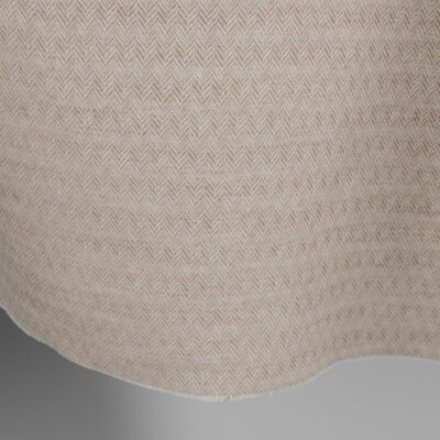 Brown and white linen cotton fabric in a herringbone pattern edge