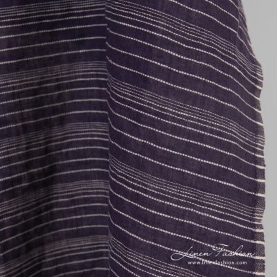 Dark blue linen fabric in stripes, specially washed to increase softness