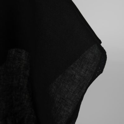 Heavy linen fabric black colour close up edge view