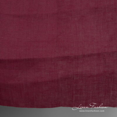 Linen fabric deep cherry colour close up detail