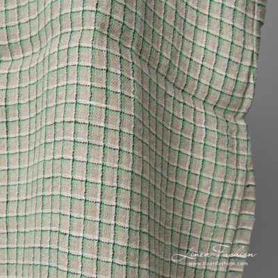 Linen grey fabric with green checks washed 7 This grey linen fabric is strong, dense and opaque, perfect for blankets, clothing and curtains
