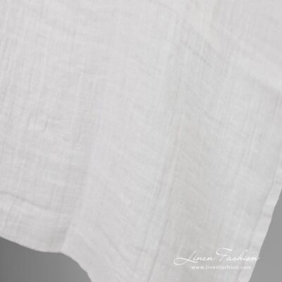Off-white linen fabric in checks, washed