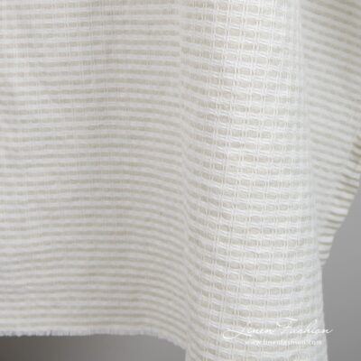 Light grey linen cotton fabric in checks, specially washed to increase softness