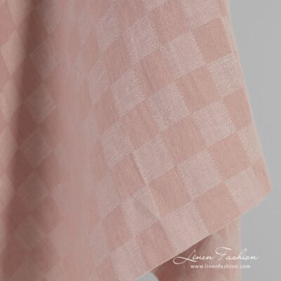 Pink linen cotton fabric in checks, specially washed to increase softness