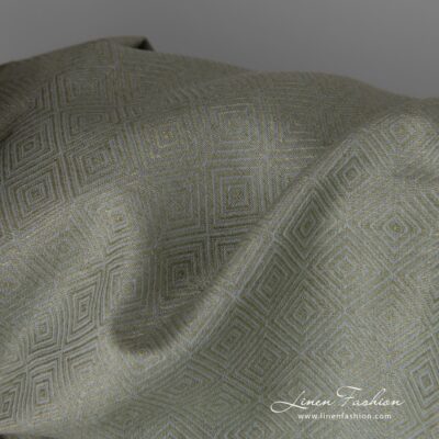 Linen cotton fabric in greyish green diamond pattern close up detail
