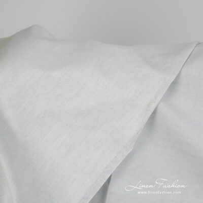 Linen cotton fabric blueish green twill weave close up detail