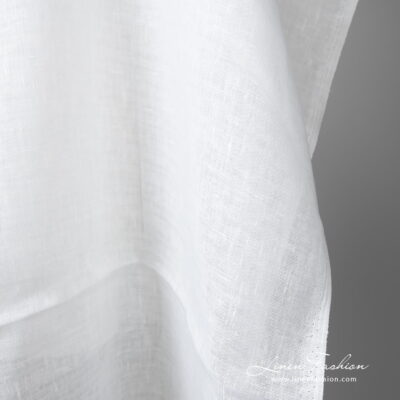 Lightweight linen fabric bright white colour edge view