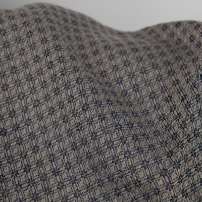 Linen cotton fabric blue and beige diamond pattern close up detail